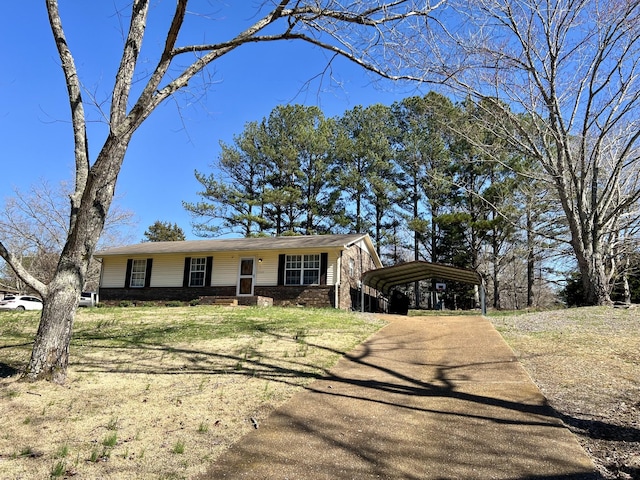 ranch-style home with a carport and a front lawn