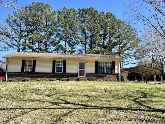 single story home with a front lawn and a carport