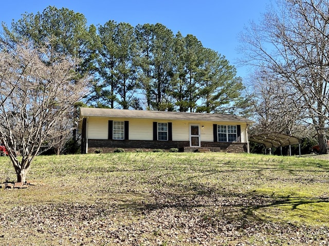 ranch-style house with a front lawn and a carport