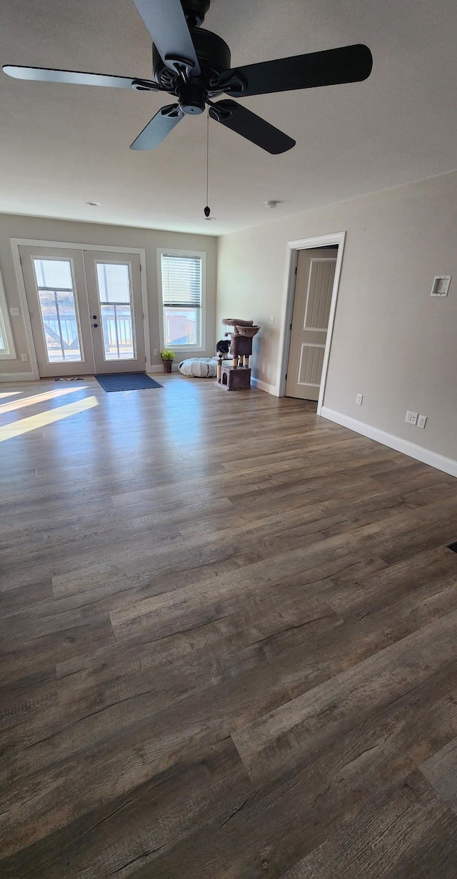 unfurnished room featuring ceiling fan and dark hardwood / wood-style flooring