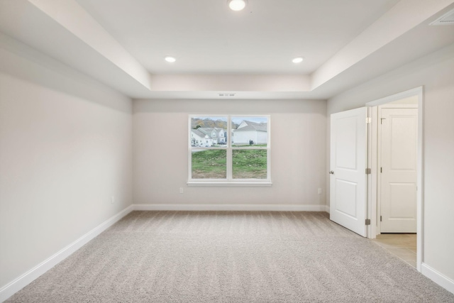 interior space featuring light carpet, recessed lighting, and baseboards