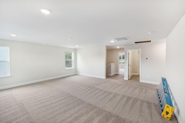 unfurnished room featuring recessed lighting, visible vents, baseboards, and light colored carpet