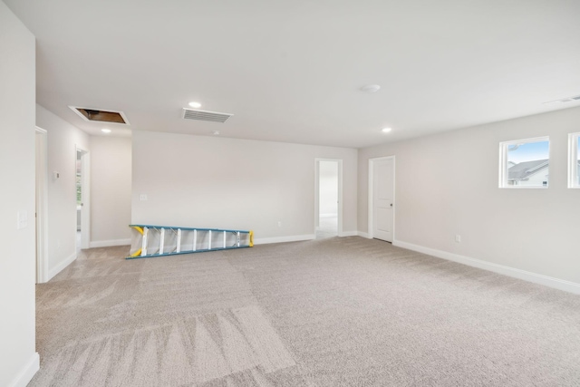 spare room featuring visible vents and baseboards