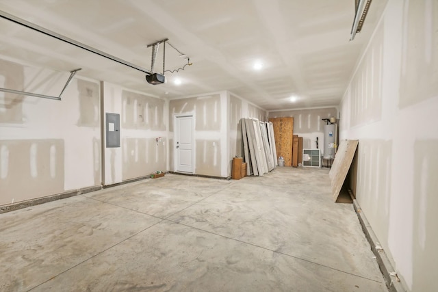 garage featuring a garage door opener, electric panel, and electric water heater