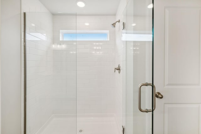 bathroom featuring a shower stall