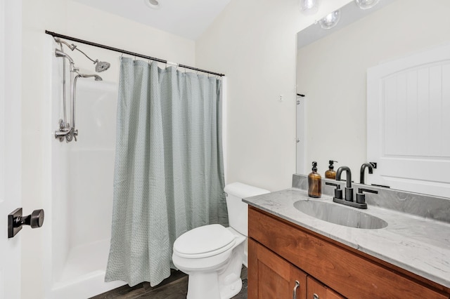 bathroom with vanity, toilet, and a shower with shower curtain