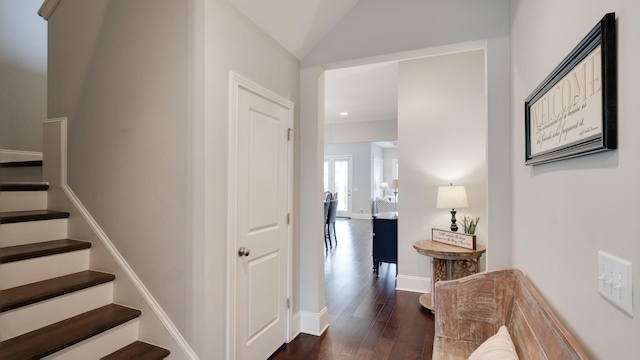 interior space featuring lofted ceiling and hardwood / wood-style floors