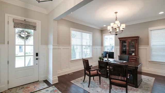 interior space featuring crown molding, dark wood-type flooring, and a chandelier