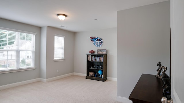 interior space featuring light colored carpet