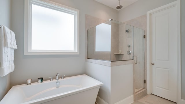 bathroom featuring separate shower and tub and tile patterned floors