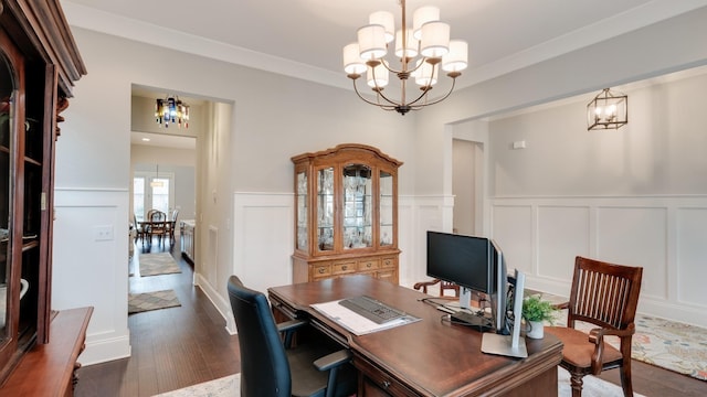 home office with dark hardwood / wood-style floors and a chandelier