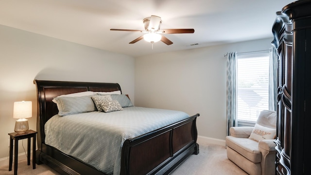 bedroom featuring light carpet and ceiling fan