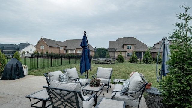 view of patio with an outdoor living space and a trampoline