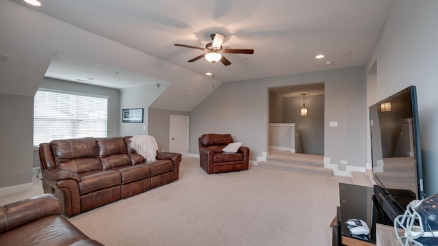 living room with light carpet, vaulted ceiling, and ceiling fan