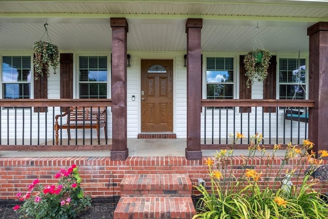 doorway to property featuring a porch