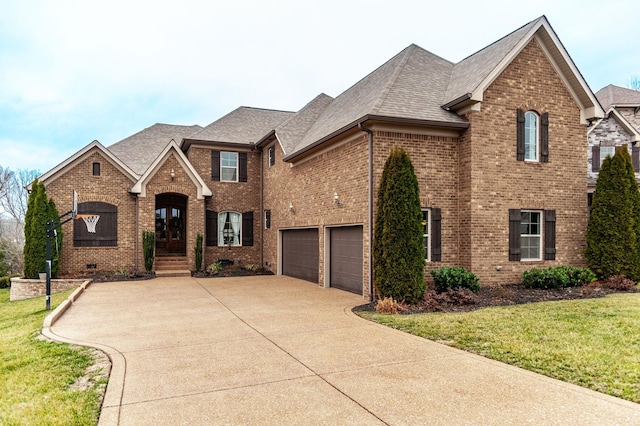 front facade with a garage and a front yard