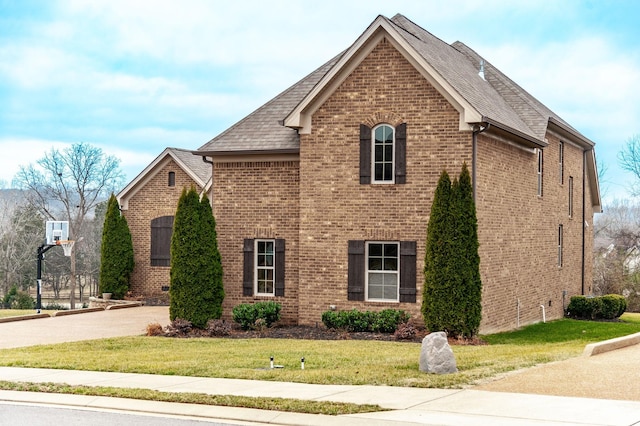 view of home's exterior with a lawn