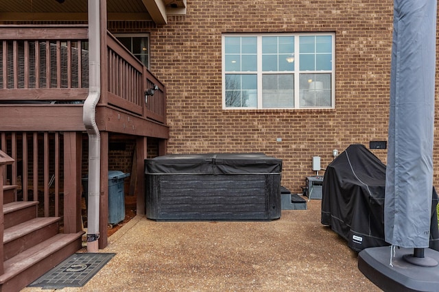 view of patio featuring a balcony