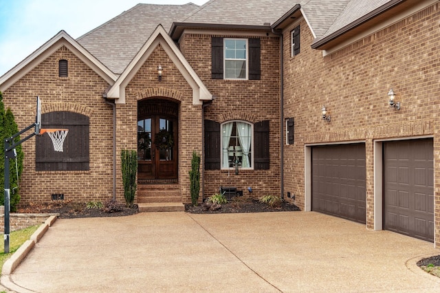 view of front facade featuring a garage and french doors