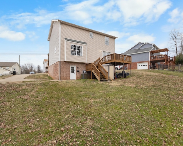 back of property featuring cooling unit, a lawn, and a deck