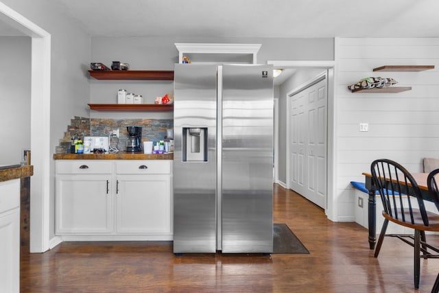 kitchen featuring dark wood-type flooring, white cabinets, and stainless steel refrigerator with ice dispenser