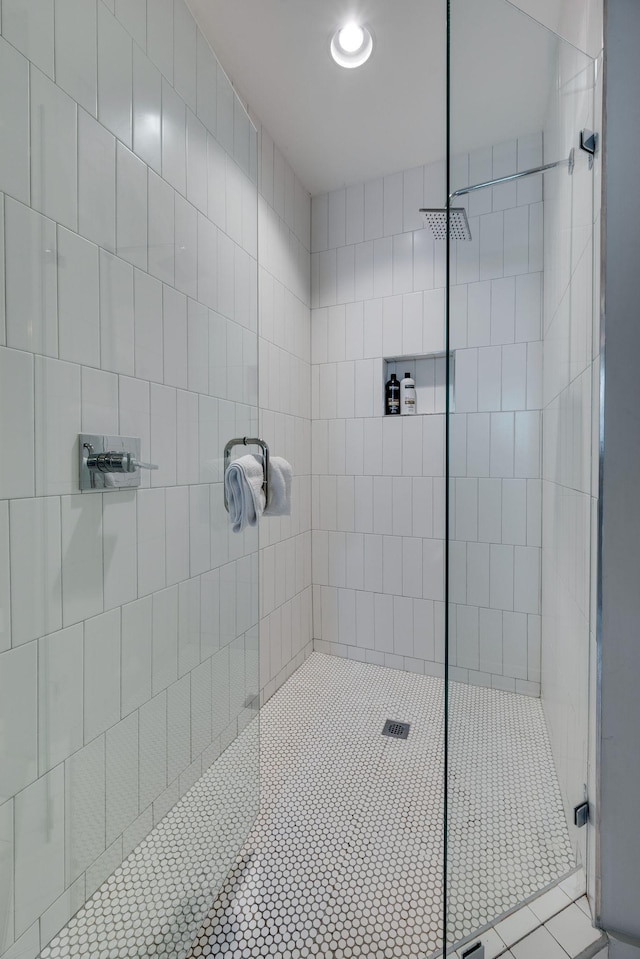 bathroom with a tile shower