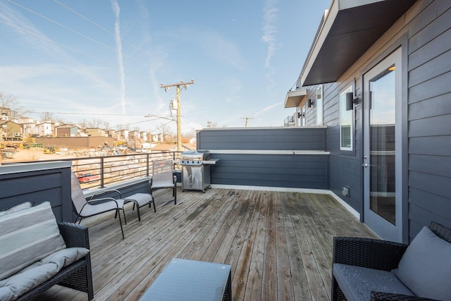 wooden terrace featuring area for grilling