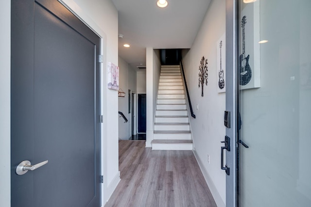 hallway with light wood-type flooring