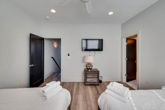 bedroom featuring wood-type flooring and ceiling fan