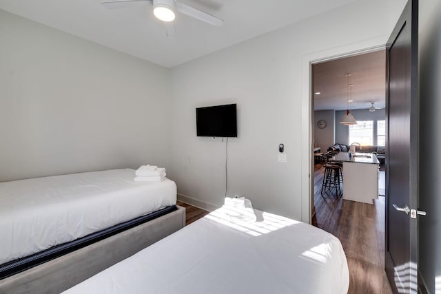 bedroom featuring dark wood-type flooring and ceiling fan