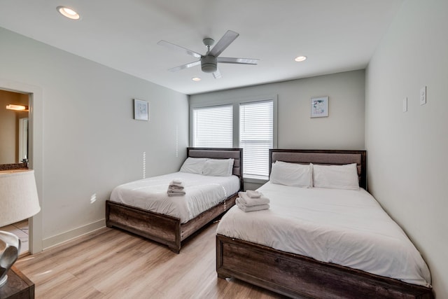 bedroom featuring ceiling fan and light hardwood / wood-style flooring