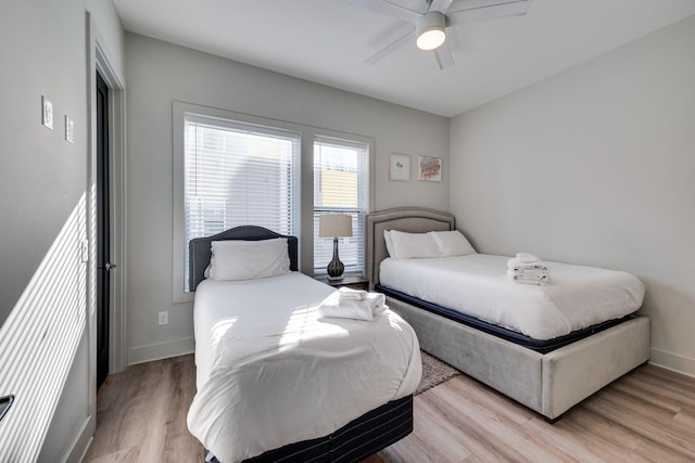 bedroom featuring ceiling fan and light hardwood / wood-style floors