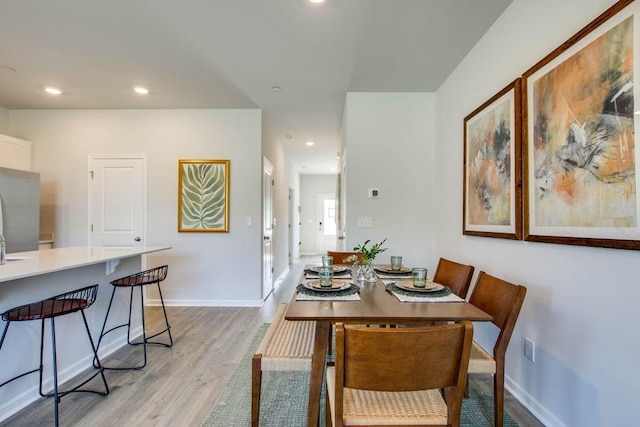 dining area featuring light wood-type flooring