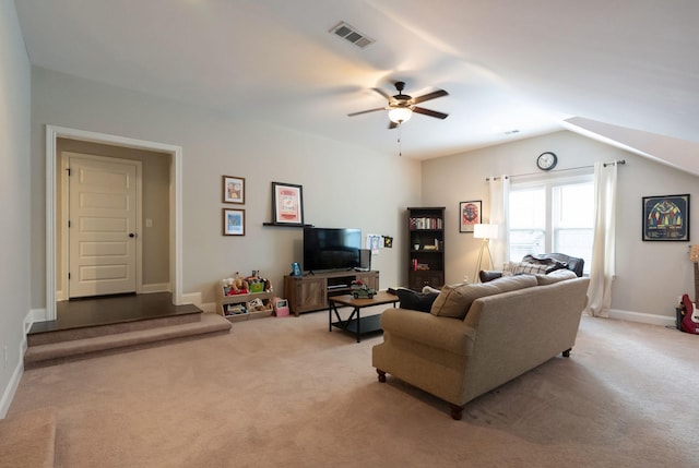 carpeted living room with vaulted ceiling and ceiling fan