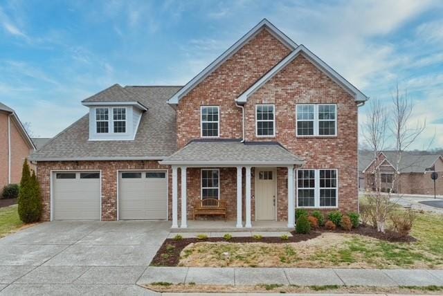 view of front of house with a garage and covered porch