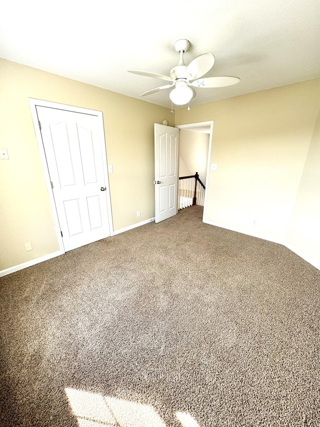 unfurnished bedroom with carpet and ceiling fan