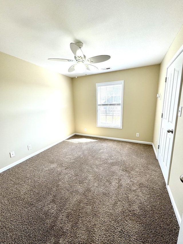 carpeted empty room with ceiling fan