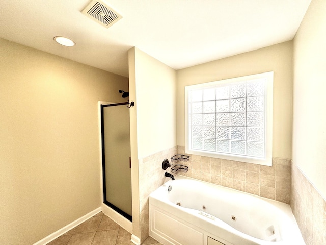 bathroom with plus walk in shower and tile patterned flooring