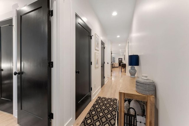 corridor featuring light hardwood / wood-style floors