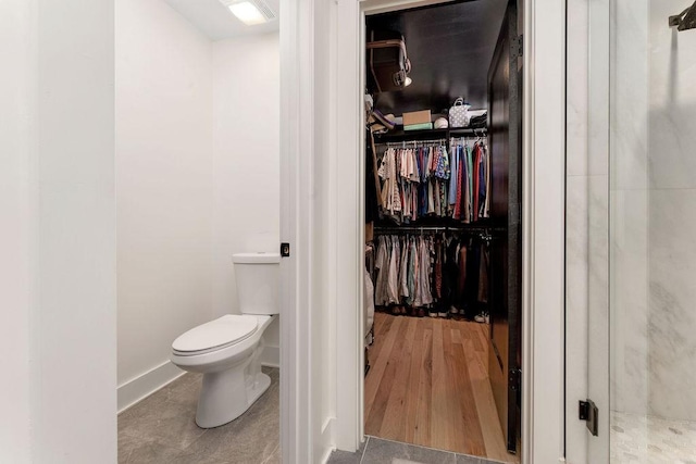 bathroom featuring tile patterned floors and toilet