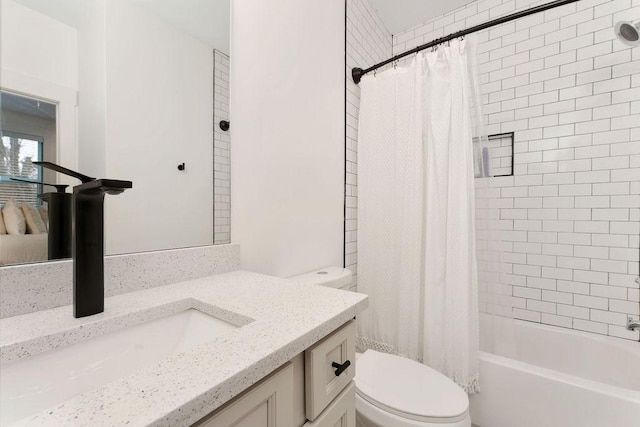 full bathroom featuring vanity, shower / bath combo, and toilet