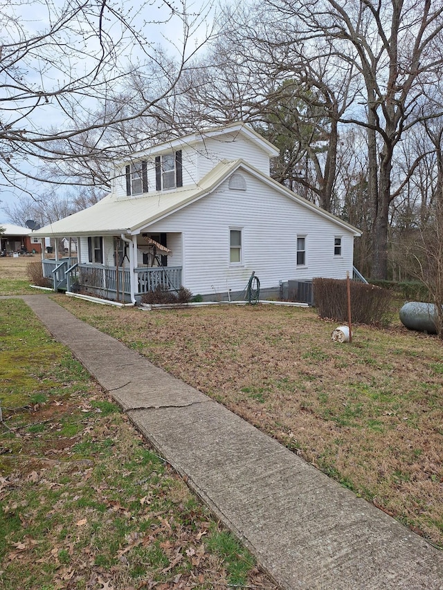 view of front of house with central AC unit and covered porch