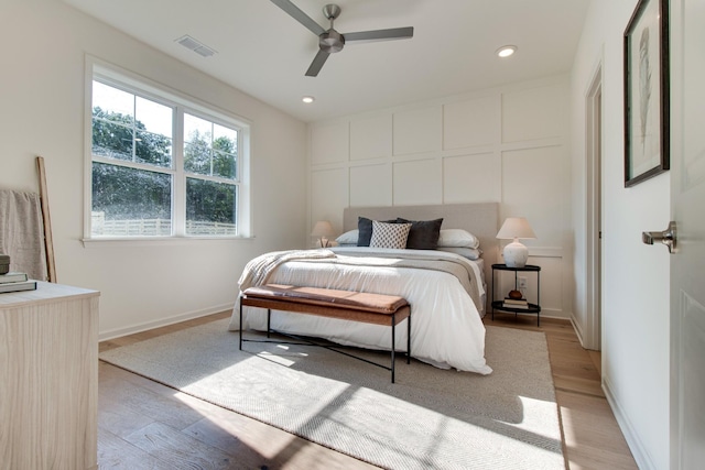 bedroom with ceiling fan and light wood-type flooring