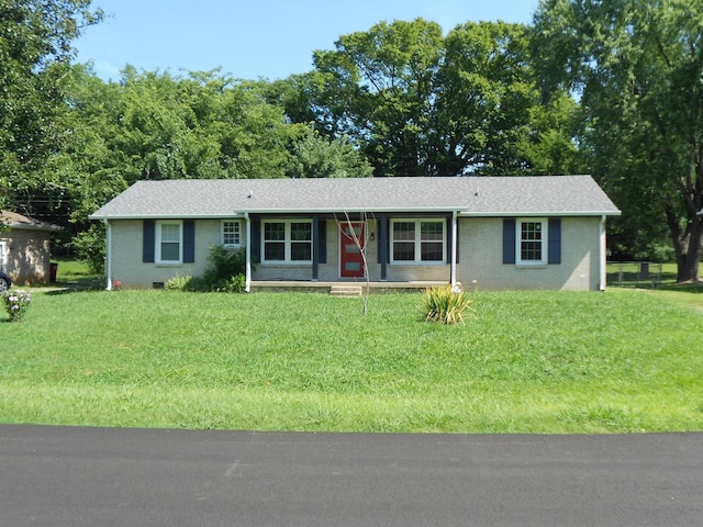 ranch-style home with a porch and a front yard