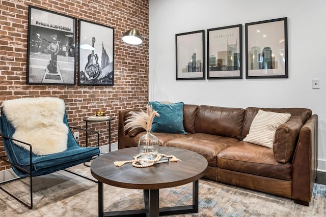 living room featuring brick wall