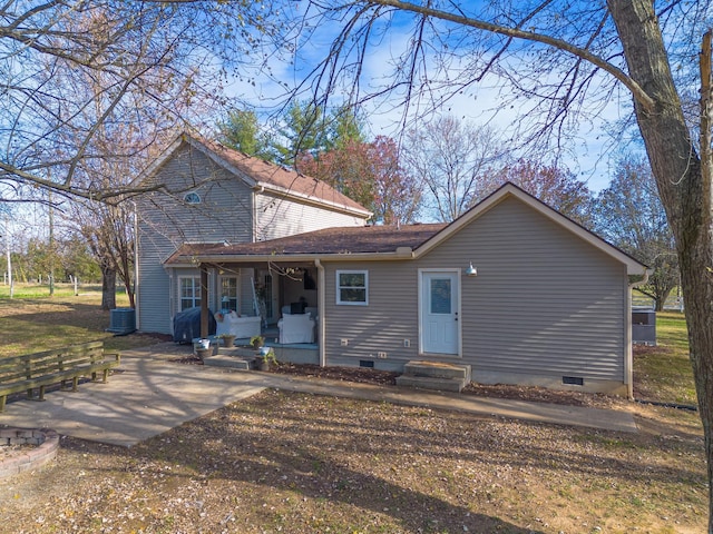 view of front of house with a porch and central air condition unit