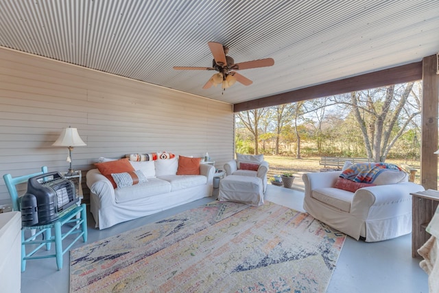 sunroom / solarium with ceiling fan and a healthy amount of sunlight