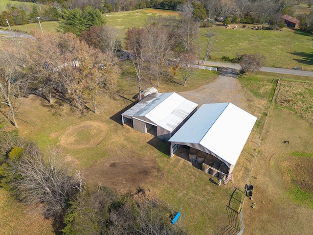 birds eye view of property with a rural view