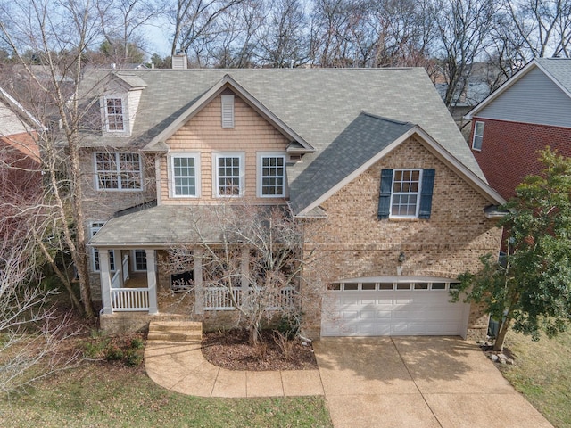 view of front facade with a porch and a garage