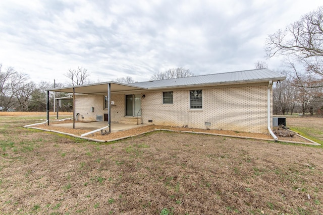 back of property featuring a yard and a patio area